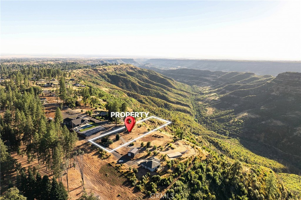 Breathtaking canyon views! And neighboring the coveted Bille Park, this 1.91 acre residential build site is an absolute dream location to design your custom home. The adjoining 1.89 acre parcel to the north is also for sale and includes a 35' x 28' metal framed workshop with 10' and 11' roll up doors. Both properties have been surveyed. Paradise Irrigation District water is in place. This spectacular parcel is sure to impress!