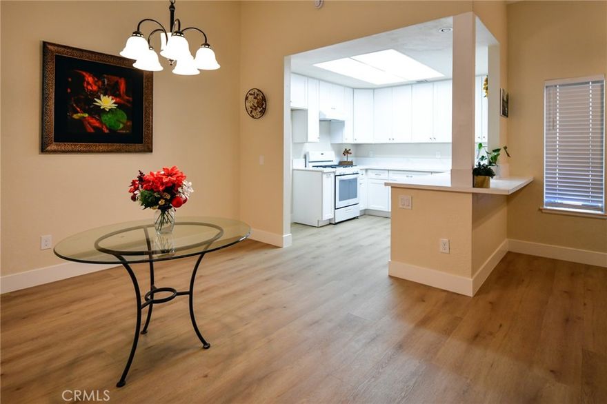 TURNKEY REMODELED Lakeside CONDO. 
Welcome to this beautifully remodeled 2 bed, 1 bath single-level condominium in the highly desirable Parkview Villas community. Offering 1,050 sqft of bright and open living space, this unit is ready for immediate occupancy. The interior boasts a spacious living room with a cozy fireplace and a high ceiling. Remodeled & Designed kitchen includes new cabinets, quartz countertops, faucet, sink, garbage disposal and dishwasher. Kitchen features a bay window.  The bathroom has also been upgraded with a new vanity, faucet, sink, medicine cabinet, mirror, shower door and toilet. Easy to maintain laminate/vinyl flooring runs throughout the main living areas. Brand new ceiling fans in both bedrooms. Master bedroom with 2 closets and a sliding door leading to the backyard. Step outside to your private, fully enclosed backyard area with newly installed vinyl fence and artificial turf for clean and easy maintenance. Enjoy the convenience of an inside laundry room and the comfort of central A/C. Parking includes a 1-car attached garage plus one additional assigned parking space. Excellent location—walking distance to elementary school and park.  Conveniently located next to supermarkets and easy access to I-15 commuters.