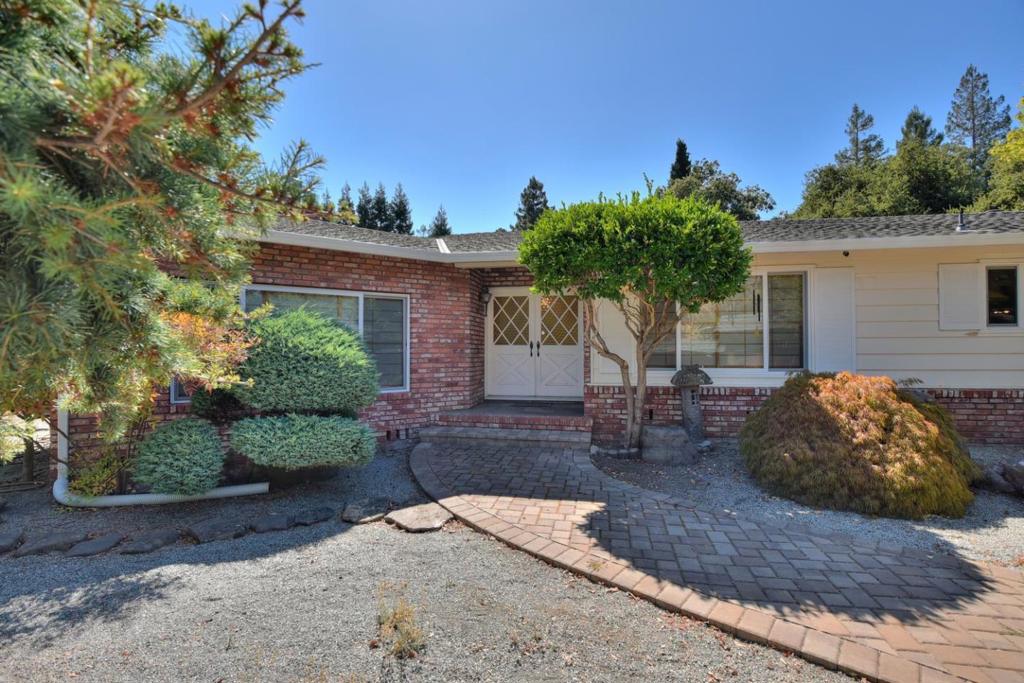 Gorgeous Estate setting, very private and secluded yet just minutes away from excellent schools & shopping.This location is fabulous! This one of a kind single level home is set back at the rear of a Cul-de-sac. You will have total privacy in this prime central Atherton neighborhood. Perfect to build your dream home or expand and update the current home. A rare opportunity to own a flat buildable acre in the heart of Atherton. Large driveway with pavers within the gates with ample parking for guests. Sparkling pool, extra storage, new carpets and paint. This is an excellent opportunity for the buyer that wants it all.