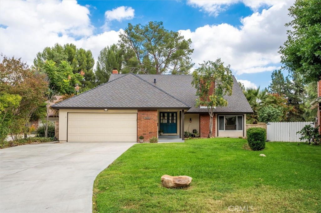 End-of-cul-de-sac home with large backyard including a pool, spa, and no rear neighbors in the sought-after Old Orchard 2 neighborhood of Valencia. This five-bedroom, three-bathroom home sits on a bonus-size lot offering added privacy and outdoor living space. The backyard features a sparkling pool and spa surrounded by mature landscape and open sky views. Inside, the updated kitchen includes modern cabinetry, stone counters, and stainless steel appliances. There are two fireplaces, one in the family room and one in the living room, adding warmth and character to the floor plan. A downstairs bedroom and bathroom with walk-in shower provide flexibility for guests or multi-generational living.
The Old Orchard II HOA offers a clubhouse, pool, spa, playground, and a neighborhood swim team, all connected by the extensive Valencia Paseo system with trails and bridges throughout the area. Residents enjoy nearby Old Orchard Park and convenient access to local favorites including Eat Real Café, Honu Coffee, The Social, Bricks, and restaurants in Old Town Newhall. This location is also near Old Orchard Elementary, Placerita Junior High, and Hart High School. Easy freeway access makes this an ideal spot for commuters while still being close to Valencia’s shops, parks, and recreation options.
Enjoy the combination of space, privacy, and community amenities in one of Valencia’s most established neighborhoods. NO mello roos!