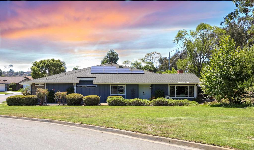 Welcome to this beautifully updated home in LAKE SAN MARCOS! The Executive Golf Course is literally a few short steps from this corner-lot home along with the serene greenbelt. One attached wall and fence but no neighbors in front just the greenbelt which makes it even more peaceful with this huge open space with the lush view. The Lake is a few more minutes beyond and ready for you to fish, boat or just enjoy the many water activities offered. Step through the grand double doors into this newly updated light-filled Great Room, where expansive windows, floor to ceiling fireplace and vaulted open beam ceilings make it open, light and bright. All of this and a great place to entertain or just relax.... The added solar tube in the kitchen provides this home with even more natural light. Energy-efficient solar panels and a newer HVAC system ensure year-round comfort as well! Perfect for entertaining, this home features a dry bar, wine fridge and a spacious kitchen peninsula that invites gatherings with ease. The newly remodeled kitchen with added recessed lighting, high end stainless appliances and custom granite counters make this an absolute dreamy kitchen. Everyone will want to spend time in here! The primary suite is a private retreat, with a huge open beamed ceiling, its own secluded patio, (just imagine having your morning coffee here to start your day) dual vanities, extensive closet organizers even a separate room for the shower! Outdoors, a PRIVATE backyard patio with pavers and lush hillside landscaping creates a tranquil garden—ideal for enjoying the glorious sunsets! Additional highlights include a two-car garage WITH golf cart parking, abundant storage, and laundry area with your washer and dryer. Residents enjoy access to premier amenities, including a championship golf course, resort-style pools, tennis courts, pickleball courts, clubhouse, spa, a fitness center, fine dining and the picturesque Lake San Marcos. This home is a few steps from the 8th hole, a few minutes from the Amalfi Restaurant, and all of the lake recreation. Located only a short 8.5 miles from Leucadia State Beaches! This property offers more than just a home—it delivers a refined lifestyle in one of San Marcos’ most coveted communities of "Lake San Marcos". All of this and close to the Pacific Ocean! Who wouldn't want to live here?!!