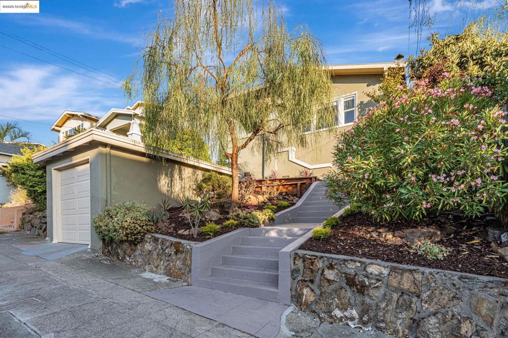 Beautifully remodeled 3BD/2BA California Craftsman just steps from vibrant Lake Merritt in the desirable Ivy Hill neighborhood. Bright open layout with natural light, built-in cabinetry, and wainscoting. Refinished hardwood floors and fresh paint create a crisp, move-in-ready feel. The primary suite opens through French doors to a spacious deck. Kitchen features butcher block counters, stainless steel appliances, and a breakfast nook. Landscaped yard with fruit trees, deck, patio, and space to garden. Garage, laundry, and storage add convenience. Close to cafés, shops, schools, BART, and freeway access. Open Saturday and Sunday from 2 to 4:30