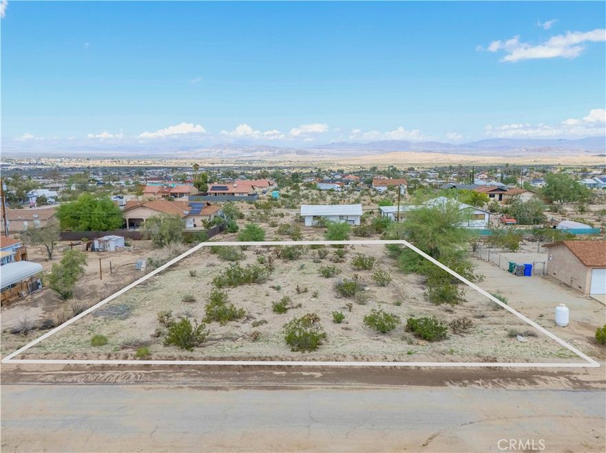 Ideally located just minutes from the entrance to Joshua Tree National Park and the 29 Palms Marine Base, this property offers an opportunity to create your own desert retreat in the heart of Twentynine Palms. The land is accessible on the last paved road in the Hanson tract with water and electric utilities nearby. Enjoy unobstructed views of the National Park to the south and quick access to the Utah Trail entrance. Whether it’s hiking, climbing, catching spectacular sunrises and vibrant sunsets, stargazing, or simply soaking in the peaceful Mojave Desert landscape, you’ll have it all at your doorstep. This lot is perfect for building a primary residence, a vacation getaway, or an investment property. More than just land, it’s a lifestyle shaped by natural beauty, quiet seclusion, and endless possibilities. Don’t miss your chance to own a parcel ready for your vision and waiting to become your desert escape.