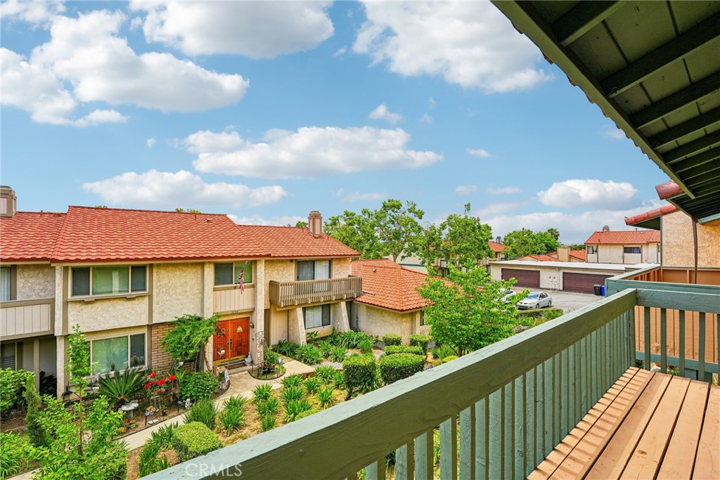 Updated Montclair Town Center Condo – Move-in Ready! Featuring 3 bedrooms and 3 bathrooms with 1,426 sq ft of living space, a large private patio, and a 2-car garage. The interior of this upgraded home includes vinyl plank flooring, textured ceilings, baseboards, and a newer HVAC system. The living room boasts a stacked stone fireplace and opens to the kitchen, which features a bar seating area, granite countertops, tile backsplash, white cabinetry, and appliances including a 4-burner cooktop, built-in oven, microwave, and dishwasher. A formal dining area and a half bathroom complete the main floor. Take the staircase with a wrought iron banister to the second floor, where you’ll find all 3 bedrooms, including the spacious primary bedroom with mirrored closets, a private bathroom, and a balcony with great views! A full-size hall bathroom serves the two secondary bedrooms. The fully fenced backyard patio is ready for the new owner's design and also provides access to the 2-car garage. Residents can also enjoy the community pool, spa, and playground. Low HOA fee and centrally located near schools, shopping, and more!