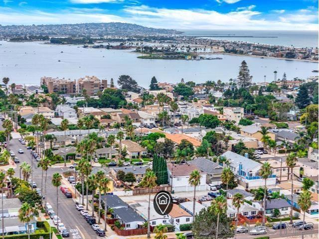 Walk to the ocean or Bay, it's a few blocks away! Completely remodeled 2 Beds single story with it's own patio and storage shed.New flooring, new Kitchen with new appliances and new bathroom.Vaulted ceiling,Tankless water heater and new washer/Dryer inside.New Mini split AC. Also has alley access for parking.