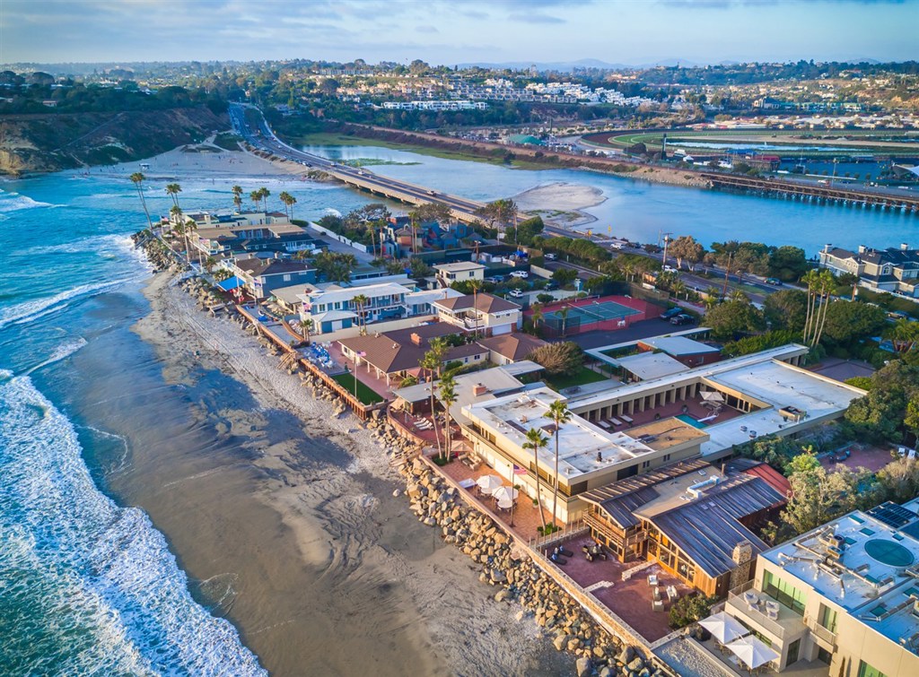 Extremely rare half acre property on the sand situated on one of the largest lots on the Del Mar beach. Upon entering the private gate of this notable midcentury style Sim Bruce Richards designed home, you can't help but exhale as the gable of its cedar pitched roof comes into view. A trellised arbor leads you past a 1BD/1BA guest home, leaving you in the expansive courtyard complete with a pool & spa at its heart. Neighborhoods: Beach Colony Equipment: Dryer, Range/Oven, Washer Other Fees: 0 Sewer: Sewer Connected Topography: LL