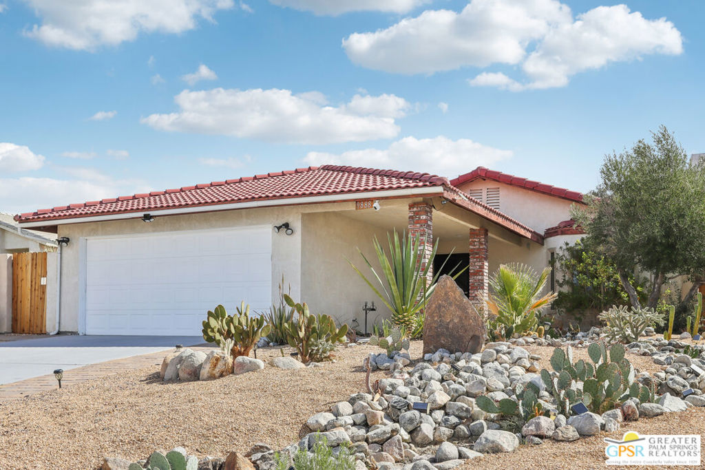 Welcome to your beautifully updated retreat, nestled on a peaceful street in the hills of Desert Hot Springs. This home boasts striking curb appeal, complemented by breathtaking mountain views and low-maintenance desert landscaping. Step inside to discover an inviting open floor plan filled with natural light. The interior has been refreshed with lighter flooring that brightens up the entire space, enhancing the home's airy, modern feel. The stylish living room features a cozy fireplace, perfect for relaxing evenings. The adjacent kitchen is a chef's dream, showcasing sleek granite countertops, a stunning backsplash, and a standout range hood that adds both function and flair. The open-concept design flows seamlessly into the living area, creating the perfect space for entertaining. Just off the kitchen, a charming dining area awaits, complete with a swanky bar area for serving up cocktails and conversation. The updated bathrooms offer modern finishes, including contemporary vanities and a sleek walk-in shower in the primary. Outside, the expansive backyard is a serene oasis with endless possibilities whether you envision a pool, spa, or a stylish outdoor lounge area to soak in the desert sunsets. There's even room to add a guest house or casita, making it ideal for hosting friends, family, or creating a private retreat. This wonderful home also features solar panels, so large electric bills are a thing of the past. Don't miss this incredible opportunity schedule your private showing today!