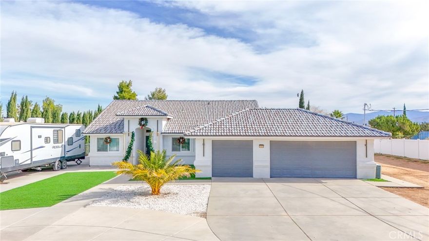 You don't want to miss this amazing home located in Hesperia! Seller thought of everything when building this home and sparred no cost with all the upgrades. Let's start with the great room; you will love the open floor plan. The fireplace is adorned with the custom granite that you will find throughout the home. Kitchen is open to the great room and with large breakfast bar. White custom cabinetry with beautiful timeless granite. The three bedrooms are to the right side of home with a full size bath and a master bathroom. The hallway bathroom has a  shower combo, granite counters and granite flooring. The beautiful on suite bath has custom cabinetry, double sinks and granite counter tops, a lot of natural lighting accented with recessed lighting. The laundry room is equipped with a utility sink, plenty of upper and lower cabinets and topped off with the same custom granite that you see throughout the home. You will be amazed with the fully finished, oversized 4 car garage and automatic garage door openers, additional lighting and windows that offer natural light. Central heat and AC system that is ducted in every room. It sits on a large lot, fully fenced. The covered patio runs nearly the length of the home and is built into the structure. Extra concrete walkways around the sides. Equipped with outside electrical receptacles for your convenience and is on Public SEWER. To build this magnificent home in todays market would cost you well over the seller's asking price. Also this property runs on Solar system that is fully owned.