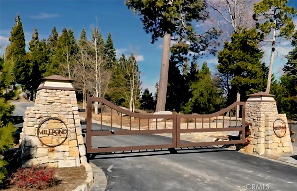 Build Your Dream Home with Sweeping Lake Views in Prestigious Mill Pond at Lake Arrowhead:
Here’s your chance to claim one of the most desirable pieces of land in Lake Arrowhead’s exclusive Mill Pond community—a private, gated enclave known for its elegance, natural beauty, and unbeatable location. Just minutes from lakeside trails, the marina, and the shops and dining of Lake Arrowhead Village, this property combines the serenity of mountain living with convenient access to everything you need. Situated on a gentle downslope with clear, uninterrupted views of the lake, this lot is ready for your vision. Underground utilities—including electricity—preserve the scenery, while wide, well-maintained roads ensure easy access year-round. With construction booming and custom homes rising throughout the community, now is the perfect time to invest. Ownership includes full lake rights, so you can start enjoying the water and the mountain lifestyle from day one.