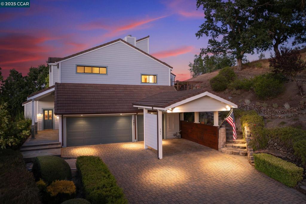 Perched on over an acre in Parkmead, custom-built 4-bedroom retreat blends craftsmanship with breathtaking panoramic views. Private driveway leads to a 3-car garage and a home featuring hardwood floors, custom millwork, and soaring ceilings. The grand living room showcases a fireplace and expansive picture windows framing rolling hills, while the formal dining room, perched above, offers an elegant space for entertaining. Gourmet kitchen includes a spacious peninsula, Wolf range, KitchenAid appliances, oak cabinetry, recessed lighting & a bright breakfast nook with deck access. The luxurious primary suite offers stunning views, a dual-sided fireplace, private outdoor access, dual sinks, a soaking tub, and a walk-in shower. Three additional bedrooms provide flexibility, while multiple bonus spaces offer options for an office, media lounge, art studio, or reading retreat. The newly rebuilt deck is an outdoor sanctuary, perfect for relaxation or entertaining. Nestled in a prime location, this home is walkable to Parkmead Elementary. Minutes to Las Lomas High, Kaiser, downtown Walnut Creek, top-rated restaurants, shopping, and scenic trails. Zoned for top-rated schools, this is a rare opportunity to own a private hillside retreat with unparalleled views and exceptional craftsmanship. Views: Ridge