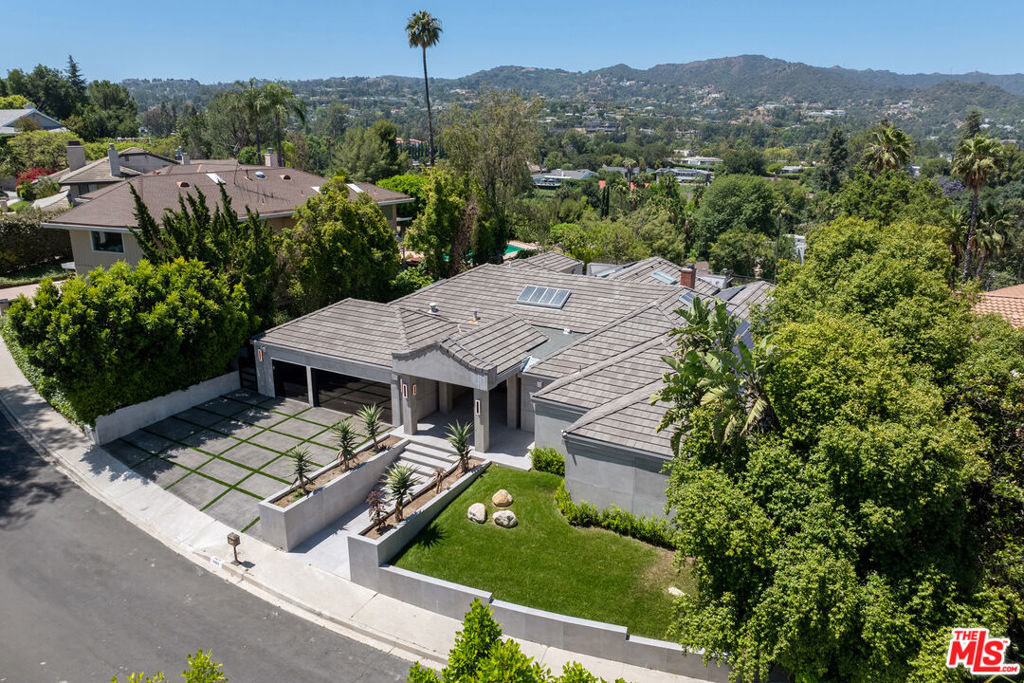Prime Encino home available for lease. Nestled south of Ventura Boulevard in one of the area's most sought-after neighborhoods, this renovated 4-bedroom, 3.5-bathroom home offers luxury living with breathtaking views.Step inside to discover a light-filled open floor plan featuring high-end finishes, designer details, and state-of-the-art smart home technology throughout. The chef's kitchen boasts top-of-the-line appliances, sleek cabinetry, and an expansive island perfect for entertaining. The spacious living and dining areas flow seamlessly to the outdoors, where you'll find a private oasis.Enjoy panoramic canyon views from the pool and backyard ideal for relaxing or hosting unforgettable gatherings. The primary suite is a true retreat with a spa-like bathroom and custom walk-in closet.