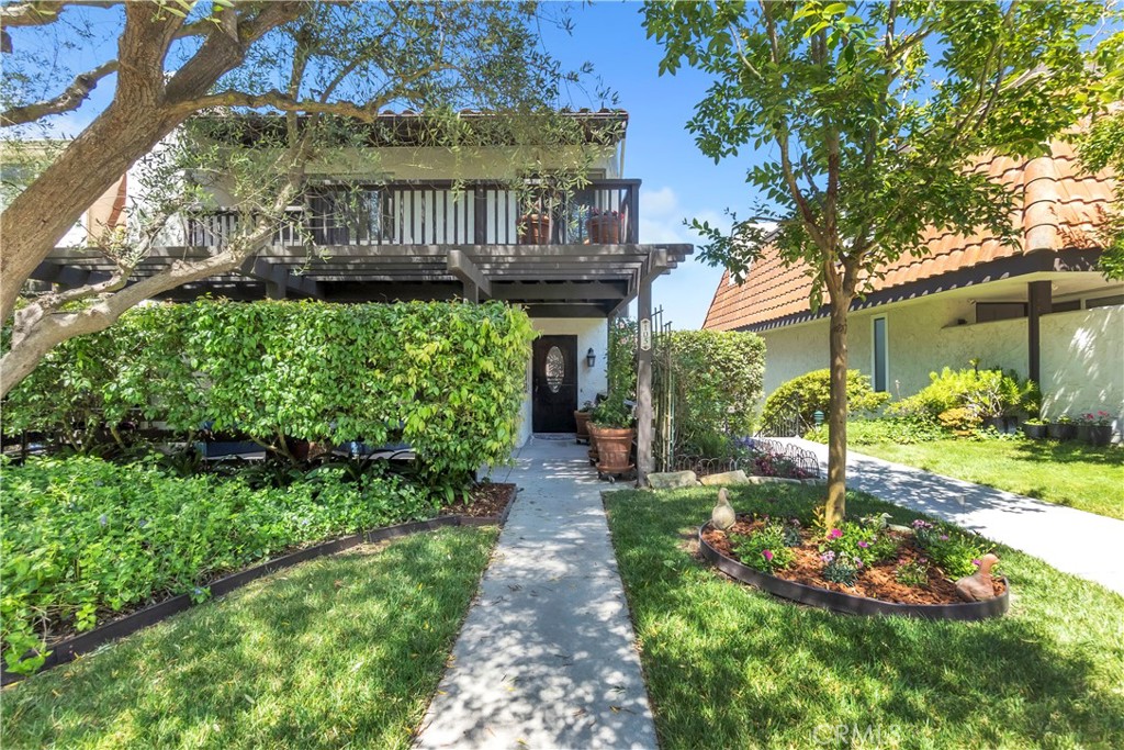 Located in the prestigious 24/7 guard-gated community of The Terraces and within the top-rated Palos Verdes Peninsula Unified School District, this beautifully updated end-unit townhome offers privacy, comfort, and sweeping views of the LA Basin, Downtown, and surrounding mountains from primary bedroom. Ideally positioned on a premium lot with open green space on two sides, the home enjoys East-West exposure, filling the interior with natural light and refreshing ocean breezes throughout the day. Featuring fresh interior paint, updated laminate flooring, and pre-wiring for a security system, the home is also certified for high-speed internet and TV connectivity. The inviting living room boasts a cozy fireplace, plantation shutters with custom accent lighting, and opens to a private balcony—perfect for relaxing or entertaining. A private patio tucked away from neighbors provides an ideal setting for enjoying meals outdoors in peace and seclusion. The bright kitchen includes a cheerful breakfast nook, refinished cabinetry, a new dishwasher, a 5-burner gas cooktop, a double oven with convection captivity, and ample storage for home chef. The spacious primary suite offers dual walk-in closets, room-darkening blinds, and an elegant ensuite bathroom with customized marble countertops, dual sinks, tile flooring, and a deep relaxing bathtub. Two additional bedrooms include ceiling fans, with one featuring a custom-built raised bunk bed and its own private balcony. The upstairs bathroom features customized marble countertops, tile flooring, and a generous storage space. The attached two-car garage has a freshly painted floor, extensive built-in cabinetry, double wardrobe closets, a newer automated garage door system, and a versatile bonus room ideal for a home office or study. Residents of The Terraces enjoy resort-style amenities, including five swimming pools, multiple spas, tennis courts, a children’s playground, a clubhouse, and beautifully maintained grounds. Blending modern updates with an unbeatable location and captivating views, this home presents a rare opportunity to own a truly special property in Palos Verdes.