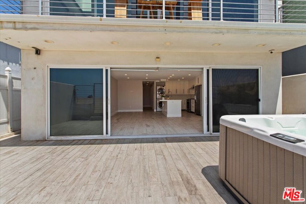 Ground level, DIRECT BEACH ACCESS. Oceanfront 3 bed 2 bath home. With PRIVATE HOT TUB right in front of the beach. You have direct access to the beach and sand. Unobstructed view of the ocean and sand. Brand new flooring being installed. Fully updated throughout with stainless steel appliances. Laundry in unit and air conditioning and heating throughout. Comes with 2 onsite parking spaces, tandem. Walking distance to market, restaurants, and shops in the Playa del Rey village.