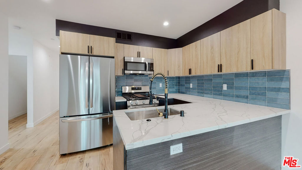 ** PET FRIENDLY ** WASHER/DRYER ** CENTRAL A/C ** 2 ASSIGNED SIDE-BY-SIDE COVERED PARKING ** BALCONIES ** MODERN CONSTRUCTION ** Welcome to The Gloria Townhomes, a stunning collection of newly built, designer 3-story residences tucked away in one of the most charming and peaceful pockets of Sherman Oaks. Surrounded by tree-lined streets and a quiet neighborhood feel, yet just moments from the vibrant energy of Van Nuys and easy access to the 101 and 405, this location perfectly blends suburban calm with urban convenience. Each spacious townhome offers 4 bedrooms and 3 bathrooms, thoughtfully laid out across three levels to maximize privacy, flow, and natural light. Enjoy luxuriously appointed interiors featuring open-concept living and dining areas, chef-inspired kitchens with stainless steel appliances, custom cabinetry, and elegant designer fixtures throughout. Each home includes several en-suite bedrooms with generous closets, plus a built-in washer and dryer, and central air and heat for year-round comfort. Outside, you'll find two private parking spaces, including covered carports, all within a gated and secure property. Best of all, pets are welcome, making this the perfect home for you and your furry companions! Whether you're hosting friends or enjoying a quiet night in, The Gloria Townhomes deliver a rare combination of luxury, space, and charm in one of the Valley's most sought-after locations.