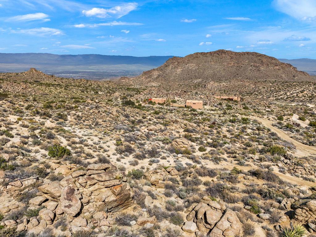 A Special Opportunity to own 2 contiguous View Parcels, 4.69 Acres, checking ''all the boxes' for those not willing to settle for a less than Stunning Build Site for their Custom Home and the Best Value for your Dollar ~ LOCATION: A cooler, more comfortable 3400' elevation, 12 miles above the luxurious desert communities, offering all major services, including world class dining, entertainment, shopping and health care ~ Travel made easy with the Palm Springs International Airport an easy 30 minutes away ~ COMMUNITY: Chapman Ranchos is a private, gated, No HOA community nestled within the Santa Rosa and San Jacinto National Monument, dotted with unique and stunning custom luxury homes, beautifully maintained roads, surrounded by US Forestry and BLM Lands with access right out your ''door'' to world class hiking, mountain biking and a myriad of outdoor adventure opportunities ~ Underground utilities include High Speed Fiber Optics for ultimate connectivity ~ Great neighbors! PARCEL ATTRIBUTES: This stunning higher elevation parcel boasts some of the best day and night time views of the desert, sunrise and sunset views over the mountains are enhanced by dramatic nature and rock scape with several possible build sites ~ This purchase includes a rare Community Water Share, eliminating the need and expense of drilling a private well ~ Top of the community, end of cul de sac location gives you ultimate privacy, peace and quiet ~