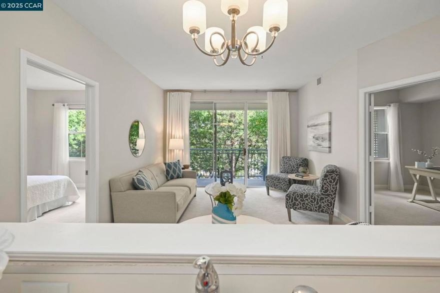 Beautiful 2-bedroom, 2-bathroom condo in The Waterford, a 55+ independent active senior living community in Rossmoor. Overlooking trees and facing away from the parking lot, this bright second-floor unit features an open kitchen that flows into the dining area and living room with sliding glass doors leading to a lovely deck. The primary suite offers a separate vanity area and an additional closet. The second bathroom includes a stall shower and in-unit washer and dryer. Elevator access allows for a no-step entry. Additional storage is conveniently located just one door down the hall. Carpet was replaced and the unit was freshly painted the week of September 22, 2025. HOA dues include water, trash, recycling, Comcast basic cable, and internet. Residents enjoy weekly housekeeping, one meal per day, and access to all activities and amenities. Community bus service provides transportation to nearby shopping areas and BART. Security and front-gate monitoring are also included.