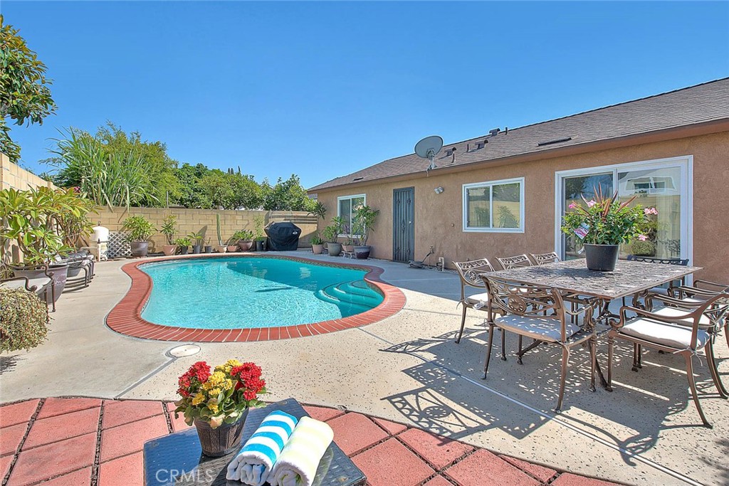 Welcome to Your Anaheim Oasis!
Step inside this beautiful single-family pool home, privately tucked behind its own gates for added charm and security. From the moment you enter, you’ll be greeted by a warm and inviting living room that flows seamlessly into the open-concept kitchen—perfect for family gatherings and entertaining friends.
This spacious home offers a generous primary suite along with three additional bedrooms, providing plenty of space for everyone. Outside, enjoy sunny California days in your sparkling pool, ideal for summer barbecues and weekend fun. The front yard features a lush guava tree, and in the backyard, you’ll find fresh, vibrant chilis for those who love to garden or cook.
Lovingly maintained and move-in ready, this home blends comfort, style, and convenience. Located in the heart of Anaheim, close to shopping, dining, and entertainment, it’s a perfect fit for families, first-time buyers, or anyone seeking a private retreat.
Don’t miss your chance—this one is priced to sell!