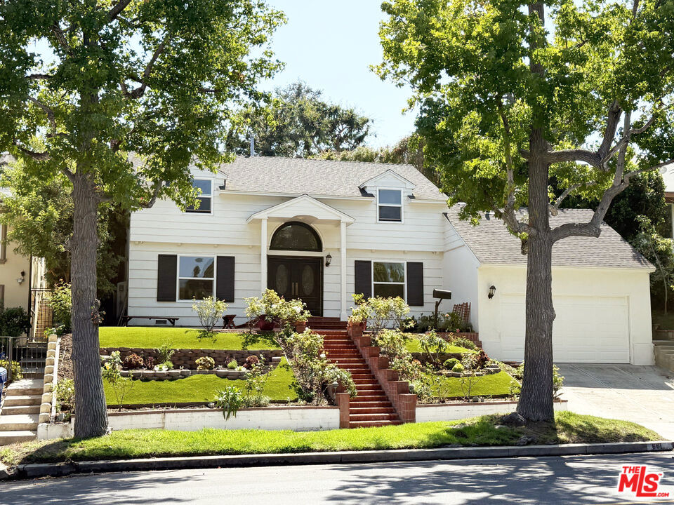 Perfectly positioned in the heart of prestigious Little Holmby, this timeless residence blends classic charm with modern comfort. From the moment you enter the dramatic two-story foyer, you'll feel the warmth and sophistication of this exceptional home. Abundant natural light enhances every space. The formal living room, complete with a decorative fireplace offers the perfect setting for entertaining and a cozy den/office with an additional decorative fireplace provides an ideal work-from-home retreat. The formal dining room flows seamlessly into the gourmet kitchen, featuring stylish cabinetry, granite countertops, tile floors, and premium stainless steel appliances including refrigerator, cooktop, range oven, microwave, and dishwasher. Adjacent to the kitchen, you'll find a laundry closet, powder room, and a second staircase leading to a private one-bedroom suite with attached bathroom ideal for guests, in-laws, or staff quarters. Upstairs, the expansive primary suite boasts generous closet space and an en-suite bathroom. All of the 3 additional bedrooms includes built-in closets and/or cabinetry for exceptional storage and organization plus a full bathroom with dual sinks, separate shower, and soaking tub. Private backyard with multiple fruit trees. Attached two-car garage and parking in the driveway. Enjoy easy access to Beverly Hills, Century City, and Westwood, with world-class shopping, dining, and entertainment just minutes away.