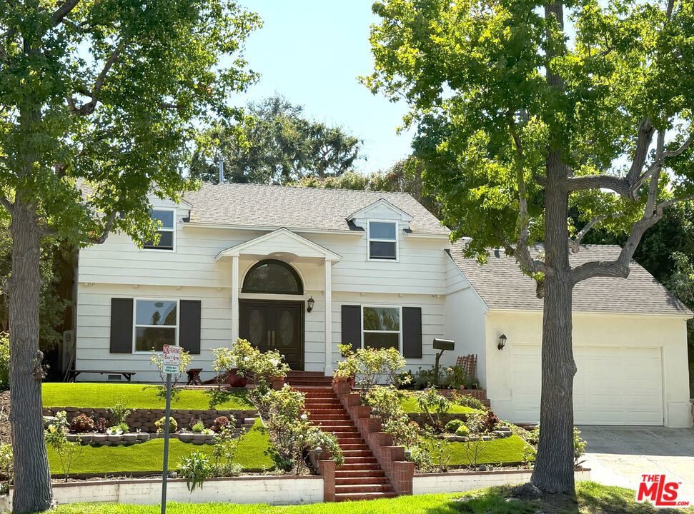 Perfectly positioned in the heart of prestigious Little Holmby, this timeless residence blends classic charm with modern comfort. From the moment you enter the dramatic two-story foyer, you'll feel the warmth and sophistication of this exceptional home. Abundant natural light enhances every space. The formal living room, complete with a decorative fireplace offers the perfect setting for entertaining and a cozy den/office with an additional decorative fireplace provides an ideal work-from-home retreat. The formal dining room flows seamlessly into the gourmet kitchen, featuring stylish cabinetry, granite countertops, tile floors, and premium stainless steel appliances including refrigerator, cooktop, range oven, microwave, and dishwasher. Adjacent to the kitchen, you'll find a laundry closet, powder room, and a second staircase leading to a private one-bedroom suite with attached bathroom ideal for guests, in-laws, or staff quarters. Upstairs, the expansive primary suite boasts generous closet space and an en-suite bathroom. All of the 3 additional bedrooms includes built-in closets and/or cabinetry for exceptional storage and organization plus a full bathroom with dual sinks, separate shower, and soaking tub. Private backyard with multiple fruit trees. Attached two-car garage and parking in the driveway. Enjoy easy access to Beverly Hills, Century City, and Westwood, with world-class shopping, dining, and entertainment just minutes away.