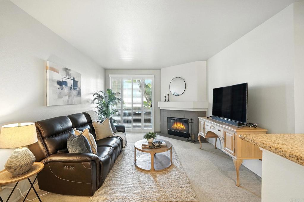 Experience resort-style living in the heart of Mission Valley with this turnkey 2-bedroom, 2-bath condo located in the highly sought-after River Colony community. This beautifully maintained ground-level home features an open and functional floor plan with spacious bedrooms on opposite sides for added privacy, and tasteful upgrades throughout—including granite countertops, plantation shutters, and a cozy fireplace. The light-filled living area seamlessly connects to a private west-facing patio, perfect for enjoying gentle ocean breezes and natural sunlight throughout the day. Pride of ownership is evident, with a newer HVAC system installed in 2021 (with a 12-year parts warranty) and in-unit washer/dryer also from 2021, offering year-round comfort and convenience. Enjoy two of the best parking spaces in the secure underground garage with easy access and extra room, plus first-floor proximity to scenic bike paths along the San Diego River, pet-walking areas, and immediate elevator access for everyday ease. River Colony boasts lush landscaping and an array of resort-style amenities, including a sparkling pool and spa, a fully equipped fitness center, a reading lounge, and community event space. Perfectly positioned just steps from the Green Line Trolley with direct service to Downtown, Little Italy, and Petco Park, and within walking distance to Starbucks, Target, Mission Valley Mall, restaurants, banks, medical facilities, and the 24/7 Wag Hotel for pets. With no flood insurance required, low-maintenance living, and the potential for discounted rates options and no lender fee future refinancing may be available for qualified buyers for this home, this turnkey condo offers a rare opportunity to own in one of San Diego’s most central and vibrant neighborhoods. Whether you're a first-time homebuyer, investor, or looking to downsize in style, this is Mission Valley living at its finest.