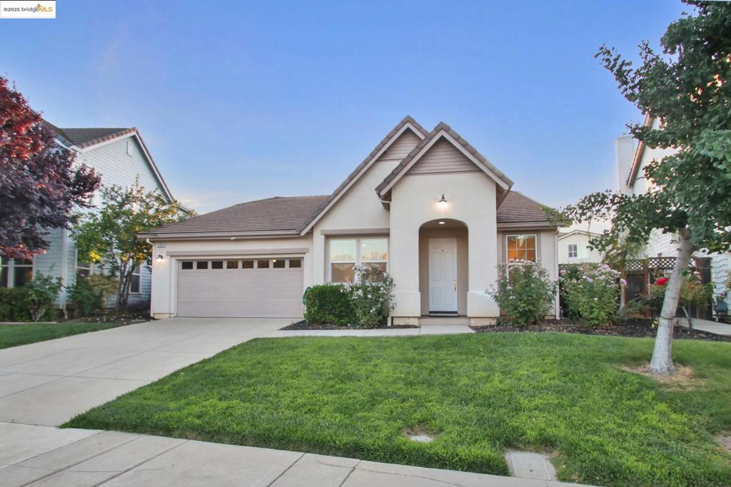 Wonderful Rose Garden 4 bedroom 2 bath single story home. Premium location is directly across the street from Rose Garden Park, community clubhouse and pools. Move in ready! Brand new LVP flooring and full interior paint provide light & bright ambiance. Lush landscaping & covered porch welcome you and your guests. Gorgeous kitchen with slab granite counters, island & raised seating area. Stainless steel appliances! Pantry. Eat in space. Spacious living & dining rooms. Family room with ceiling fan/light and elegant fireplace. Large primary bedroom with ceiling fan/light, walk-in closet & views of the back yard. Primary bath features soaker tub & separate stall shower with bench. Extra upper & lower cabinets in hall! Laundry room with sink, counter space & lots of storage. Bring your gas or electric dryer. Recessed lighting. 2” blinds and custom window treatments! Situated on a large premium lot that widens in the back. Great free-form patio with shade structure to create your dream yard around! Sprinklers are already installed. Portable gas BBQ stays. Wide side yards. Enjoy life in Rose Garden with 2 pools (large & toddler), clubhouse, multiple parks & playgrounds, BBQs & picnic areas, the local trail & more. Close to shopping, restaurants & much more! Brentwood schools.