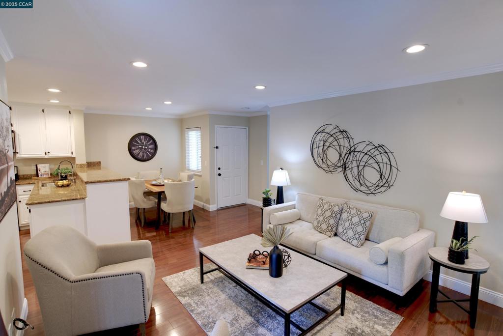 Welcome to Country Village, where comfort meets convenience! This beautifully maintained top-floor corner unit offers privacy and tranquility, with majestic redwood trees providing afternoon shade. Step inside to discover brand-new carpeting, fresh paint, and elegant granite countertops. The inviting living room, complete with a cozy fireplace, creates the perfect ambiance for relaxation. The spacious dining area comfortably accommodates a large table, making it ideal for entertaining. The sunlit primary bedroom features a French door leading to the private patio, a generous walk-in closet, and an en-suite bathroom. Both bedrooms are well-proportioned, with a thoughtfully designed floor plan that maximizes space and functionality. Additionally HVAC and water heater have recently been replaced. Enjoy the fantastic amenities at Country Village, including a pool, spa, tennis courts, and BBQ area. Conveniently located with easy freeway access, you're just minutes from shopping, dining, hardware stores, and grocery options—all within a mile. Don’t miss the opportunity to own this delightful condo in a prime Martinez location!