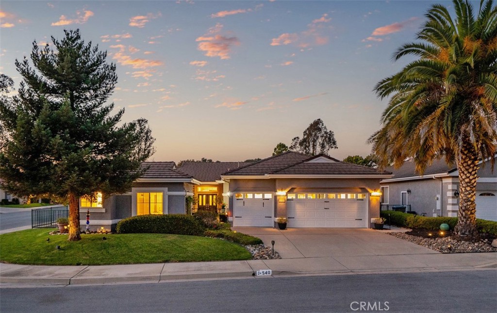 This beautifully remodeled home offers a harmonious blend of modern elegance and timeless design, featuring a spacious open floor plan filled with abundant natural light streaming through expansive windows—creating an airy and inviting atmosphere. With 3 bedrooms, 3 baths, there's plenty of space, all thoughtfully updated to reflect today’s most sought-after designer trends. The open living area centers around a cozy fireplace, perfect for intimate gatherings or quiet evenings. The large contemporary kitchen is a true showstopper, boasting quartz countertops, white cabinetry, a generous island, farmhouse sink, double ovens, and a breakfast bar—ideal for both everyday living and entertaining. The remodeled bathrooms evoke a luxurious spa-like experience, showcasing exquisite large-scale porcelain tile, double vanities, frameless glass shower enclosures, a soaking tub, and designer fixtures that transform each space into a sanctuary of relaxation and style. Every detail—from the designer lighting, crown molding, closet organizers, air conditioning and premium finishes—has been meticulously curated to offer a serene retreat within your own home. Outdoor highlights include easy access to beautifully landscaped yards featuring fruit trees and a spacious covered patio, designed for low maintenance while enhancing the property’s stunning curb appeal. A separate casita/in-law quarters provides flexible living options or the perfect guest retreat, while the oversized 3-car garage offers ample storage. This enchanting home has been tastefully refreshed to deliver comfort, convenience, and contemporary charm. The Good Life is calling, don't miss the opportunity.