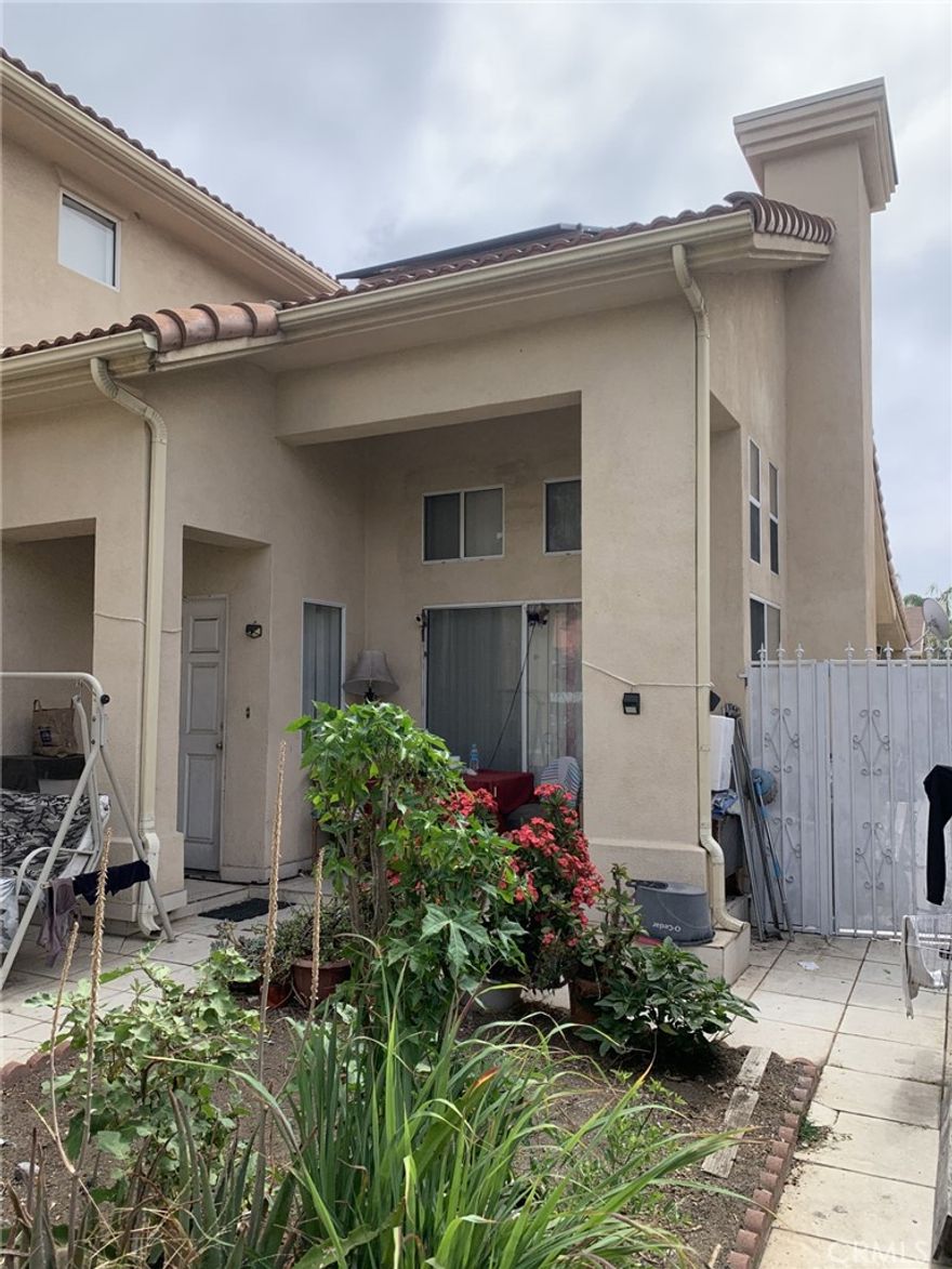 Single Family 4br +2 3/4 bath and a Legal 2br +1Ba ADU/Guest house. The Home has paid for Solar Panel system. The 2 story home has a generous size family room downstairs and downstairs bedroom with 3/4 bath. It has an open kitchen to the family room. There is a formal dining room connected to kitchen on one side and to the Living room with 2 level ceilings. There is a large covered patio across the back with the ADU/Guest house across the yard. There is a 2 car garage with direct access to the main house. The Yard is completely enclosed with electric gate for the driveway. There are 3 spaces inside the gate plus the 2 car garage. Great set up for a large family or live in house and rent out the ADU/Guest house