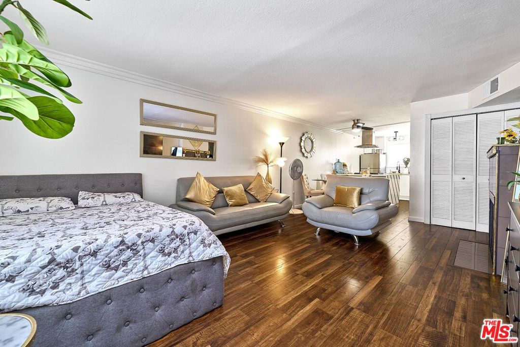 Seller has paid all mandatory special assessments!! Very affordable and upgraded condo featuring a living room, dining area, kitchen, and primary bedroom with a walk-in closet. Includes in-unit washer and dryer and central HVAC system. Comes with two parking spaces. Community amenities include a gym, pool, and sauna. Currently occupied by good tenants paying $2,400/month great for investment. The building is scheduled for renovations, adding value for the new owner. Excellent location close to Lake Balboa, shopping centers, and restaurants.
