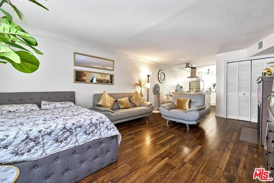 Seller has paid all mandatory special assessments!! Currently leased, this property is being sold as an investment, making it an excellent opportunity for buyers seeking immediate rental income(Monthly $2,400) . Very affordable and upgraded condo featuring a living room, dining area, kitchen, and primary bedroom with a walk-in closet. Includes in-unit washer and dryer and central HVAC system. Comes with two parking spaces. Community amenities include a gym, pool, and sauna. Currently occupied by good tenants paying $2,400/month great for investment. The building is scheduled for renovations, adding value for the new owner. Excellent location close to Lake Balboa, shopping centers, and restaurants.