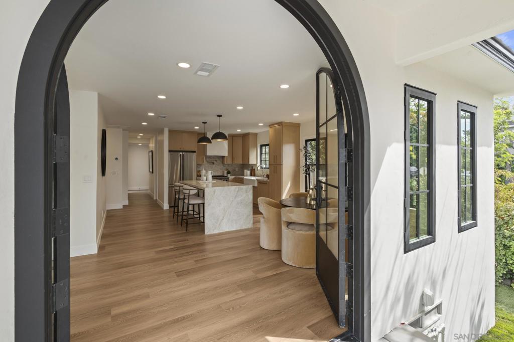 Discover the charm of this beautifully renovated single-story home in the heart of Coronado. This residence offers three bedrooms, two bathrooms, and a spacious two-car garage, along with a brand-new roof, energy-efficient windows, a designer kitchen, and tastefully remodeled bathrooms. Professionally curated finishes and meticulously landscaped grounds create a warm, inviting atmosphere, while the outdoor barbecue area makes entertaining a breeze. Ideally located just a short walk from local schools and all that Coronado has to offer, this property blends comfort, style, and the ultimate island lifestyle.