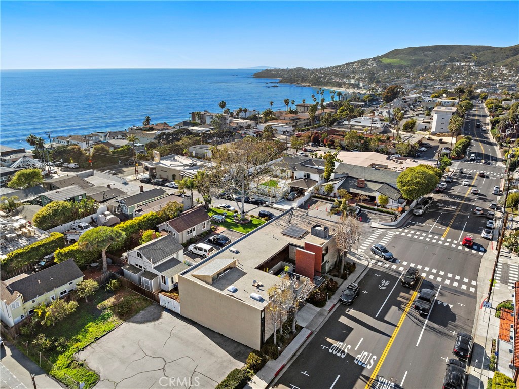 801 Glenneyre is a premier commercial office building in the heart of Laguna Beach, designed by renowned architect Fred Briggs. Just one block from the beach and a short seven-minute walk to downtown, this exceptional property offers seven professional office suites, a restaurant space, and seven covered parking spaces in a secure garage. The building features both public and private restrooms, deck, kitchenettes, and ocean views. With modern interiors, high-quality construction, and a prime location near top-tier dining, shopping, and entertainment, 801 Glenneyre presents a rare investment opportunity—offering long-term value, low management requirements, and significant future upside potential with possible conversion to residential- see City of Laguna Beach for more information.
