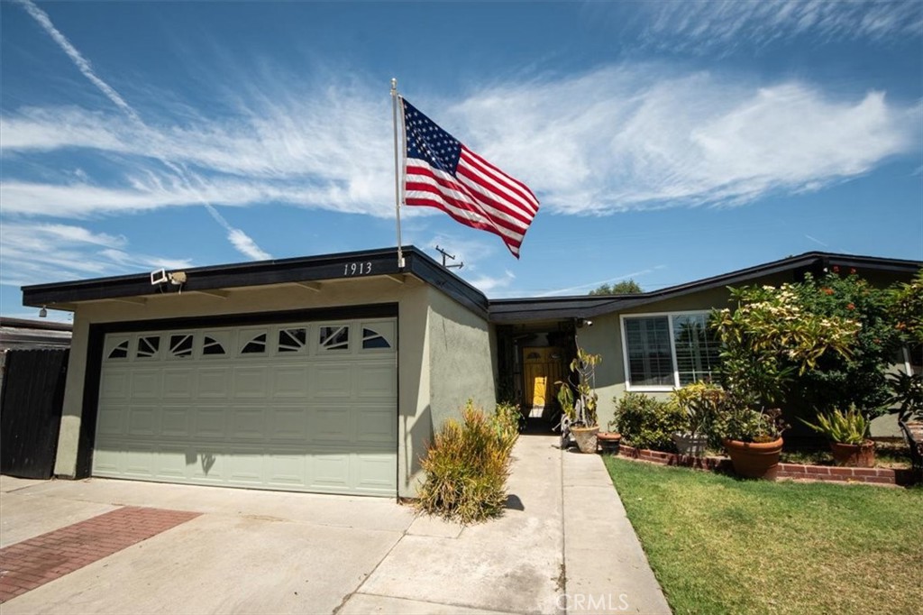 Thoughtful floor plan offers ample room for families, guests, or even a home office. The attached garage accommodates two vehicles, while the expansive lot invites a range of outdoor possibilities—from a lush garden to a play area or entertaining patio. Oversized spa on patio is functional and is included in the sale. Watch the Disneyland fireworks from your own lawn. Located within walking distance to Barton Park, Barton Elementary, Modjeska Park and convenient to local amenities, this home combines affordability, spacious living, and Anaheim charm.
