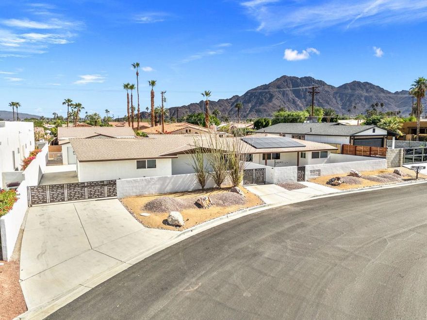 All UTILITIES INCLUDED! Full time rental, Fully remodeled & Unfurnished. This unique property boasts two separate dwellings, making it perfect for multi-generational living. The main home offers 3 spacious bedrooms and 2 modern bathrooms, while the secondary unit features 2 cozy bedrooms and 1 bathroom, making it a total of 5 bedrooms 3 bathrooms, 2 Kitchens, 2 oversized garages with new garage doors and motors. New AC's in the main home and guest home, new drywall, new paint, new flooring, new kitchens, new bathrooms, new appliances, new water heater, new custom front and backyard, 2 beautiful rolling gates, large electric fireplace in main home, new stucco on exterior walls, This home is move in ready! Nestled on a rare double lot, this property provides ample space for outdoor enjoyment and entertainment. Dive into the sparkling new pool or unwind in the soothing new spa as you take in breathtaking mountain views that surround you. The expansive yard offers endless possibilities for gardening, play, or simply relaxing in your own piece of paradise. Located just moments away from the charming Old Town La Quinta, you'll have quick access to boutique shops, gourmet dining, and vibrant community events. The 3 bedroom, 2 bathroom is renting for $3,500 per month. The second home/casita is listed for $2,500 per month, its a 2 bedroom, 1 bathroom with large garage and all UTILITIES INCLUDED