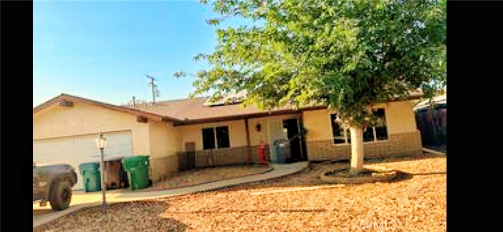 Welcome to this desirable spacious home with a large lot situated in a peaceful east Hemet neighborhood. This home offers 3 beds with 2 baths and 1552 sqft of living space boasting a pleasant floor plan with laminated/tile flooring throughout the home. The home also has a large kitchen accompanied by plenty of cabinets and granite counter tops. The kitchen leads to a massive backyard surrounded by block and wood fencing. The backyard also has a galvanized steel shed that is great for storage and a covered patio. Alongside the home you have RV-access with plenty of space for toys. In front of the home, you have a big yard and driveway leading into a 2-car garage. The home is also energy efficient with its PAID OFF SOLAR!! Conveniently located near Schools, Churches, Soboba Casino, and shopping centers. Don't miss the opportunity to call this home!!