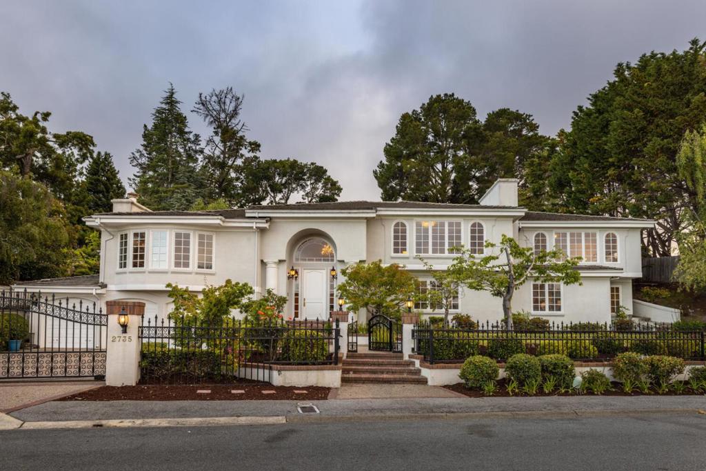 Magnificent home in quiet neighborhood with private tennis court! Gated front yard and driveway with manicured landscaping for excellent curb appeal. Open foyer and dazzling chandeliers keep light flowing from room to room. Host events of any occasion in the spacious dining room or gather in one of the many sitting rooms for conversation. The kitchen features a center island with seating for two and stainless appliances. Retreat to a comfortable bedroom at the end of the day to wind down. The split level backyard has plenty of patio space to enjoy a sunny afternoon or an evening barbeque. You will find the fenced tennis court on the upper level of the yard next to a potential kids play area or keep as extension of outdoor dining.