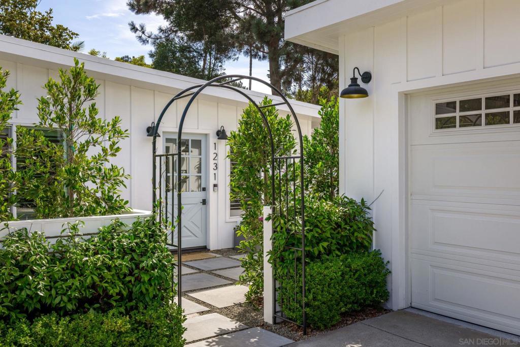 Just blocks from the surf and sand, this turnkey 3-bedroom, 2-bath beach cottage captures the soul of coastal living in one of Leucadia’s most sought-after neighborhoods. Whether you’re walking to your favorite coffee spot, biking to the beach with your surfboard, or rinsing off in the outdoor shower after a salty day in the waves — this home makes everyday life feel like a vacation. Inside, you're greeted by sun-drenched, open-concept living spaces with wide-plank oak floors, clean modern lines, and a seamless indoor-outdoor flow. Cantina-style bifold doors and a pass-through kitchen window connect the heart of the home to a private backyard oasis — complete with a lounge area and lush landscaping. The yard is made for entertaining, post-surf hangouts, morning yoga, or quiet evenings under the stars. A detached garage conversion adds flexibility as a home office, art studio, or wellness retreat. Located near shops, great schools, and Leucadia’s vibrant dining scene — this home isn’t just a place to live, it’s a lifestyle.