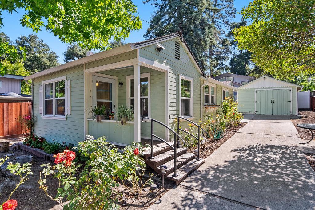 Fall in love with this darling cottage brimming with character and charm. Recent improvements include energy-efficient mini splits, dual-pane windows, and a refreshed kitchen with a sunny dining nook just right for morning coffee or quiet moments. The home offers 1 bedroom plus a flexible bonus room, perfect for a home office or creative space. Step outside to your peaceful retreat, complete with fruit trees, blooming roses, and plenty of sunny garden space to grow, relax, and enjoy. A detached art studio or guest space adds extra versatility, along with a separate garage. The property is fully fenced for privacy and has plenty of parking. Ideally located in the heart of the San Lorenzo Valley, you're close to local cafes, trails for hiking and biking, mountain views, and abundant wildlife. One of the best values in sought-after Ben Lomond. What a special second home to escape or stop renting and make this private haven your own!