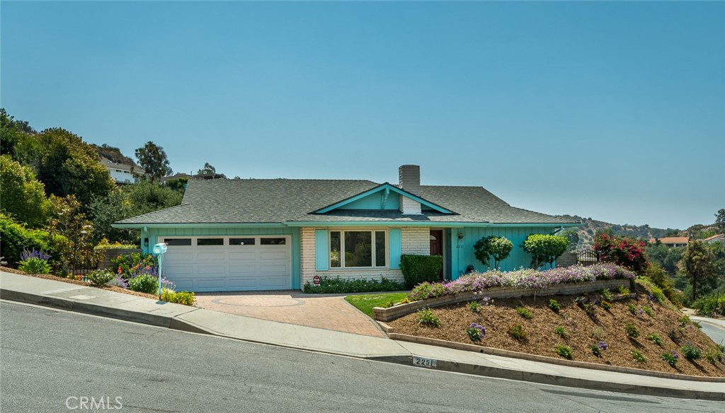 Perched atop its own private knoll, this charming home offers scenic views, a sparkling pool, and an ideal location in one of North Glendale’s most desirable neighborhoods, Montecito Park. Tucked away on a peaceful cul-de-sac, this inviting residence blends privacy, comfort, and convenience. Enjoy the benefit of being located in Glendale while also falling within the highly sought-after La Crescenta school boundaries. Inside, the living and dining areas flow together, creating a warm and welcoming space for relaxing or entertaining. The kitchen includes a cozy second dining space, perfect for casual meals or morning coffee. The primary bedroom is a serene retreat with mountain views, a double door entry and an attached en-suite bathroom. The second bedroom also enjoys gorgeous views of the surrounding hills. Step outside to a beautifully private backyard featuring a refreshing pool and plenty of space to unwind or host gatherings—all while taking in the tranquil views.