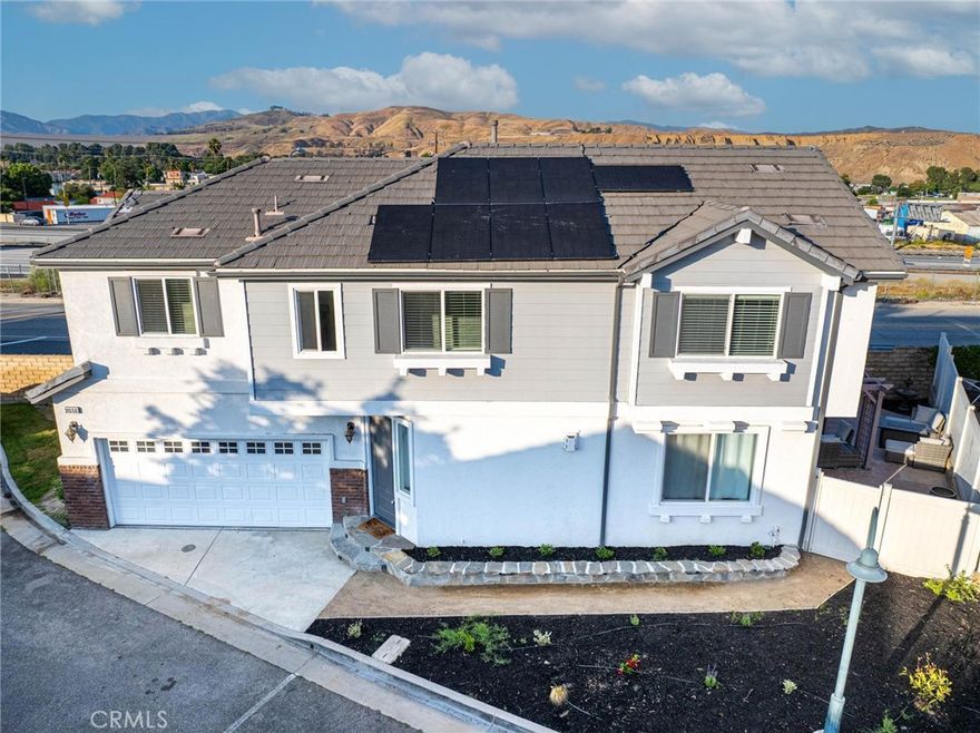 Welcome to this beautiful 4 Bed 3 bath home! One of the best locations on the block conviently situated at the end of the cul-de-sac and one of only a few with a true front yard space!!! This incredibly designed home has been well taken care of and boasts updated bathrooms and kitchen with beautful vinyl wood flooring. Freshly painted and lots of upgrades throughout, you truly need to see it to feel how great the space is. The open concept kitchen flows nicely into the dining & living room allowing for great entertaining opportinutes. Direct & easy access to the backyard off the living room creates a truly wonderful space to have friends & family over. Enjoy tons of natural light with plenty of windows and in the evenings enjoy a cozy fireplace great for a nice quiet night in or a feature piece if you're entertaining guests. One of the least expensive 4 bedroom homes in all of Castaic and boasts plenty of solar panels to cover your electric needs. You wont want to miss this one! Schedule a showing today!