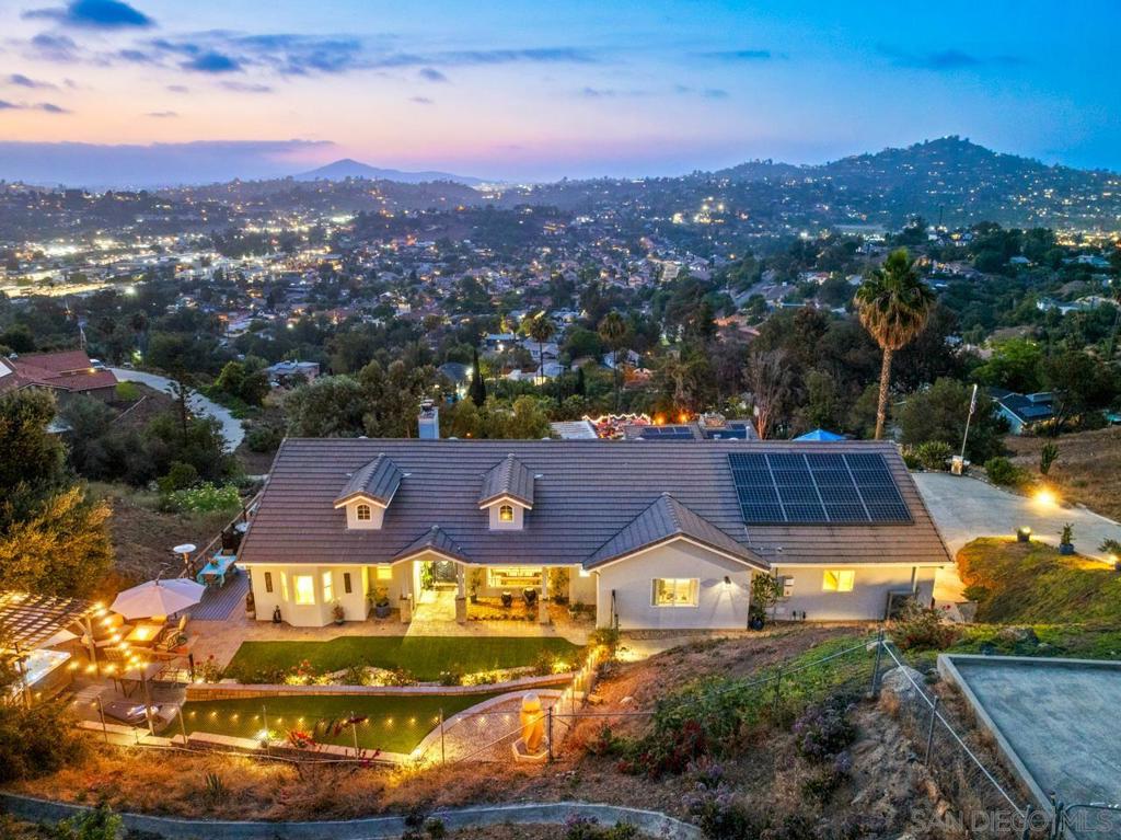 Range Pricing: $1,250,000-$1,450,000: Sweeping views to Mt. Helix Views, El Capatain & Cowles Mt this beautifully upgraded, sprawling single level home offering breathtaking views provides a flexible floor plan with additional multiple bonus rooms, great for a home gym, office and storage, delivering exceptional flexibility. Extensive upgrades include: paid solar, brand-new chef’s kitchen featuring a large island, sleek finishes, open floor plan that seamlessly connects living, dining, and kitchen areas. Outdoor living is just as impressive, with entertaining spaces in both the front, side and back of the home, ideal for sunset gatherings or quiet mornings with a view. Ample parking provides convenience for guests and multiple vehicles. Don’t miss the opportunity to own this luxurious single level, move-in-ready home with unbeatable views and lifestyle amenities. Secluded and quiet! Welcome to this beautifully reimagined five-bedroom residence, offering stunning panoramic views of Mount Helix, Cowles Mountain and El Capitan. Extensively remodeled with high-end finishes and thoughtfully designed spaces, this home is the perfect blend of style, functionality, and comfort—set in one of East County’s most scenic and desirable locations. Inside, you’ll find a versatile open floor plan with generous living space, ideal for modern households of all kinds. Five true bedrooms plus 2 bonus rooms that can be adapted for a home office, gym, playroom, or guest quarters. The open-concept layout creates a natural flow between living, dining, and kitchen areas, making it an ideal home for both daily living and entertaining. The heart of the home is the fully remodeled chef’s kitchen, featuring a large center island, custom cabinetry, sleek countertops, and top-tier appliances. The design encourages connection—with sight lines that extend into the family room, dining area, and beyond to the backyard’s sweeping views. The home has been elevated with premium upgrades, including luxurious flooring, stylish lighting, updated bathrooms, and energy-efficient features. Paid solar adds tremendous value and long-term savings, giving you both sustainability and cost efficiency. Abundant natural light floods the interior, enhanced by expansive windows that frame the property’s most compelling feature—its incredible mountain and valley views. Whether it’s sunrise coffee or sunset dinners, the jaw dropping views here become part of what you’ve always dreamed of! The front, side and back yards & decks are both designed for entertaining, with multiple patios, lawn areas, and outdoor living spaces including a Jacuzzi and 5 fire pit seating areas. Enjoy al fresco dining, weekend barbecues, or simply relax and take in the scenery in your private, peaceful setting. Are you seeking additional space for vehicles, a gym, office, storage? There is room for multiple vehicle parking. This home offers the best of both convenience and escape - it’s in a tranquil residential neighborhood, yet offers quick access to major highways, shopping and dining. With its generous footprint, modern upgrades, and jaw-dropping views, this is a rare opportunity to own a turnkey property in a premier location.