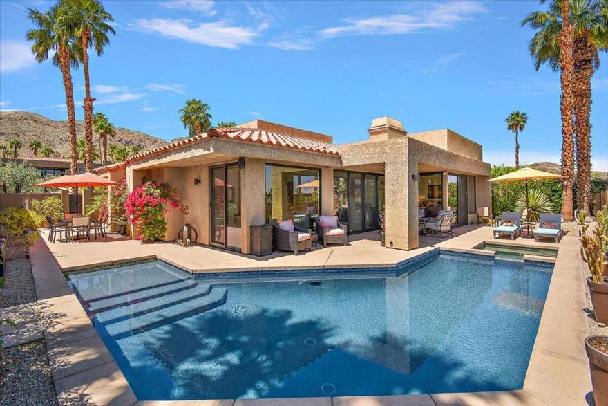 Open Floor Plan! This spectacular home features 2 primary ensuites. The 3rd bedroom is currently used as an office. Floor to ceiling patio doors in the living room, and both ensuite bedrooms. Stunning Mountain Views!  Situated on a private cul-de-sac.  Elevated luxury in Rancho Mirage!  Discover your Desert escape at 11 Vista Loma Drive, a beautifully updated 3BD/3BA, 2,260 sq ft modern retreat in the gated community of Mirage Cove. Perfectly situated high above the valley floor, this home delivers beautiful mountain views, sparkling city lights, and breathtaking desert sunrises. What makes this home stand out is its location in prestigious Rancho Mirage situated in a tranquil and magical setting. The residence is fully renovated with thoughtful finishes and open flow. Floor-to-ceiling windows frame sweeping panoramic views that bring the outdoors in. An owned solar system ensures energy efficiency. The primary suite offers spa access, dual vanities, a grand stone walk-in shower with dual rain heads, and a generous walk-in closet. A second ensuite features its own entrance, full bath, and walk-in closet -- ideal for guests or extended stays. A third bedroom, currently used as an office, is paired with a full guest bath featuring a deep soaking tub. At the heart of the home, a chef's dream kitchen featuring granite counters and high-end Kitchen-Aid appliances flows seamlessly into the great room and dining area. The outdoor living space includes a resurfaced Pebble Tec pool and spa, a covered patio, and a low-maintenance yard designed for entertaining and relaxation. Additional highlights include soaring ceilings, stone countertops throughout, a full laundry room with Maytag appliances, an EV charging station, outdoor landscape lighting and more! Residents of Mirage Cove enjoy access to a community pool, spa, tennis courts, pickleball, a private park, and RV parking. With a flexible 30+ day rental policy this property is ideal for full-time living, a seasonal escape, or investment potential. Modern. Private. Elevated. This Rancho Mirage retreat has it all and is ready for its next owner.