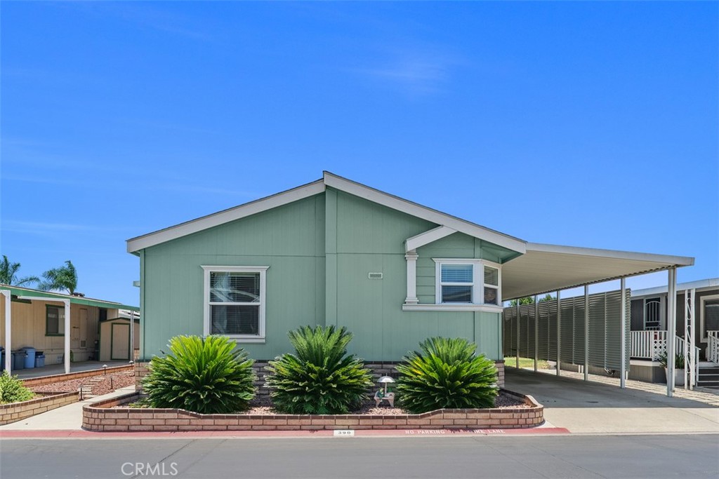 Beautiful 3-bedroom 2 bath mobile home located in the exclusive Rancho Ontario. This home's floorplan boasts the main suite in the back of the home along with the guest bedrooms. The main suite offers a tub, stand-up shower and a big walk-in closet. The home offers a semi-open concept from the dining room to the living room. The driveway can fit up to 3 small vehicles and also offers a big shed. The home offers a nice big open porch. The home has a citrus tree. Newly renovated amenities await you offering a heated pool and spa opened year-round, a hall to host any event, our clubhouse offers a billiards room, card table room, a fitness room as well as a gym and a lounge area to just sit and relax. The Park also offers an active area with two pickleball courts, bocce ball and we didn't forget about your fur babies, two dog parks. Don't miss out on the opportunity to call this beauty your home.