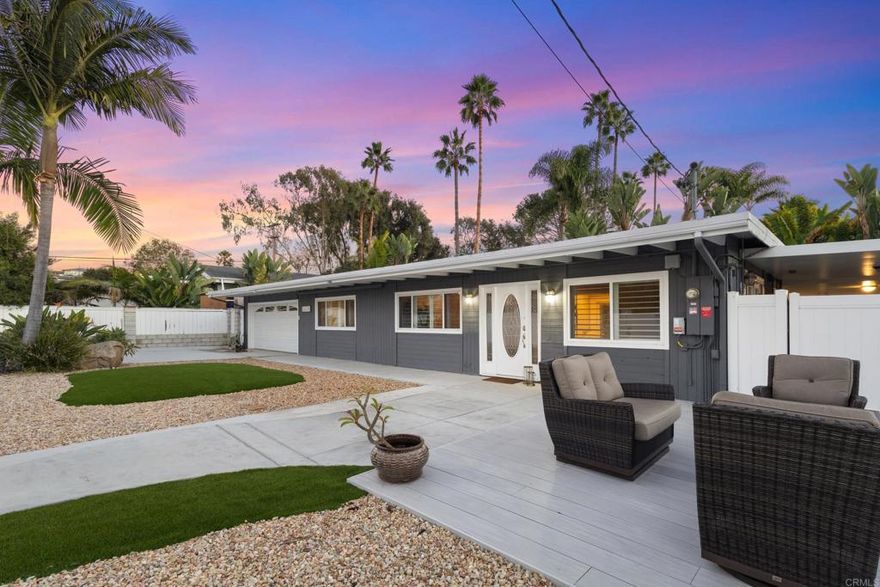 Tucked in the heart of Avocado Acres and just 1 mile to the beach, this thoughtfully transformed beach bungalow lives like a private coastal compound. Behind the automatic gate, you’ll find a fully enclosed, low-maintenance oasis designed for effortless outdoor living.  A wraparound Cali Bamboo deck stretching from the backyard to the front, sets the stage for morning coffee with butterflies and hummingbirds. The oversized (just under 9,000sf) lot is perfect for golden-hour gatherings and memorable celebrations. The yard has been thoughtfully designed to be intentionally low-maintenance. It is complete with tropical landscape, tranquil pond, turf you never have to mow, river rock, and landscape lighting create a serene retreat that feels worlds away, yet sits just minutes from the beach, restaurants, and all that Encinitas is known for.  Inside, the home has been thoughtfully appointed and includes custom details throughout. Arched details and statement wallpaper add character and purpose. Open the french doors off of both the living area and kitchen for the ideal indoor outdoor space. The kitchen features upgraded stainless steel appliances with views of your tropical oasis right outside the window.  The primary features a custom walk-in closet with convenient laundry access and green tropical views that make each morning feel like a getaway.  The fully finished and insulated garage, offers bonus space that could be for storage, hobbies, or even a creative studio. A dedicated surfboard storage room and built-in outdoor kitchen further enhance the home’s beach-centric lifestyle.  With fully PAID solar installed in 2022, drip irrigation, a private cul-de-sac feel thanks to the permanent street barricade, and secure parking inside the gate, this property offers peace of mind, privacy, and smart sustainability.  Want to take advantage of the oversized lot but maybe you need a little more space. There is plenty of room for potential to add an ADU, build up and capture the ocean views or expand as the possibilities are endless. You can always change the footprint but you can never change the location.  Whether hosting summer taco parties or simply soaking in the quiet with the doors wide open. This is a rare opportunity to blend charm, intention, and coastal lifestyle and have your very own beach retreat.