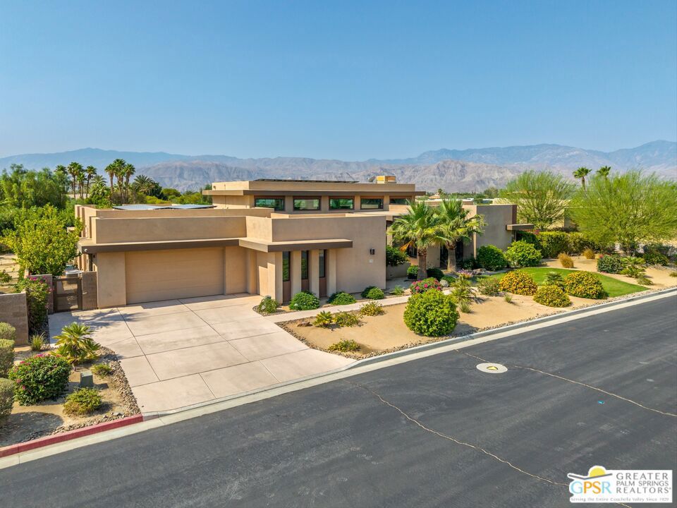 Nestled in the heart of Rancho Mirage, Estilo is an exclusive gated community of 39 high-end estate homes. With towering 16' ceilings and clerestory windows, you are immediately immersed in bountiful natural light upon entering this exceptional 3,423 sf home. Disappearing 20' sliders seamlessly merge the open-concept interior with the inviting outdoor space. A misting system on the covered patio, saltwater pool/spa, fireplace, putting green and mountain view all beckon you to experience the 18, 295 sf lot creating your own private oasis. Fabulous kitchen with quartz counters and oversized island quickly becomes the place where family and guests gather. Entertaining is easy with a spacious dining room for formal dinners, an adjacent wet bar, stacked stone fireplace and Control 4 surround sound system. With 3 bedrooms + Den/Office and 4 bathrooms living is easy in this elegant home. The relaxing primary suite features customized walk-in closet, dual sinks, large walk-in shower with seat and luxurious soaking tub. The generous secondary bedrooms each have their own full bathroom and are located at back of the house for privacy. The versatile bonus room located next to the guest suites has easy access to the patio. 3 car garage provides ample parking and storage. This very private and tranquil location provides you with the serenity and beauty you are seeking in a home. Enjoy the ultimate luxury lifestyle in this desert estate perfectly located near world-class golf, upscale dining, shopping and entertainment.
