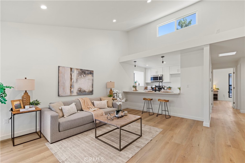 PRICED UNDER MARKET VALUE COMPLETELY REMOLDED...MUST SEE!!! Step into this stunning fully remodeled townhouse in Sun Valley, ideally situated between Burbank and North Hollywood in a secure gated community. Every inch of the 1,102 sq ft interior has been thoughtfully updated, featuring brand-new appliances, modern finishes, and refined design choices throughout. The stylish mahogany-toned kitchen shines with sleek granite countertops, contemporary cabinetry, and new stainless steel appliances.
High ceilings and oversized windows fill the living area with natural light, complemented by a gas fireplace and open-concept layout perfect for entertaining. Both spacious bedrooms boast fully renovated ensuite bathrooms, generous closet space, and designer touches. The lower-level suite opens to a private terrace, offering a peaceful outdoor retreat.
Additional highlights include new flooring, central A/C, and granite accents in both the kitchen and bathrooms. With meticulous upgrades, smart design, and a fantastic location, this turnkey townhouse blends comfort, convenience, and style—ready for you to move in and enjoy.