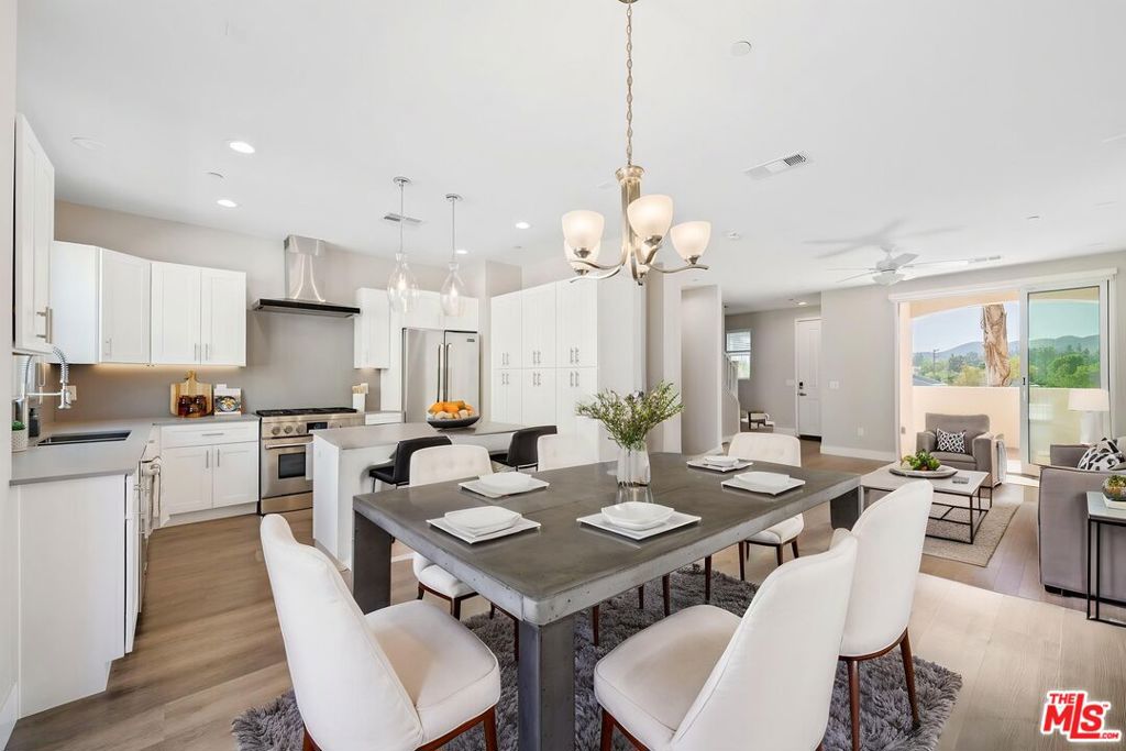 Welcome home to this stunning tri-level luxury townhome at the Paxton Calabasas! This lovely 'Belmont' model is move in ready! This beautiful 2-bedroom, 2.5-bath townhome offers the perfect blend of comfort, style, and convenience across three well designed levels. Whether you're a professional, a student, a small family or anyone in between, this thoughtfully designed townhome provides everything you need. Features include two full bedrooms on the top level, both with attached bathrooms and generous closet space. The primary bedroom features a bright bathroom with dual sinks, soaking tub with a separate full shower and an attached private balcony, with views. On the main floor, enjoy the contemporary kitchen, equipped with an island, beautiful pendant lights, stainless steel full size refrigerator, quartz countertops, oversized six burner gas stove top and large oven. Also on the main floor, you will enjoy an open dining area and family room. Step out on to your front patio through the 8 foot high sliding glass doors that fully open. The bottom level you will find the full size laundry room that features a smart washer and full size dryer, a generous bonus/ flex space with direct access to the attached 2 car garage. The garage offers a 220 volt charger. Cool off in the community pool, work out in the gym and relax in the clubhouse. Centrally located with close proximity to Malibu, Calabasas Commons, Erewhon, Westlake Promenade, less than an hour to Los Angeles, dining options, market, parks, top rated schools and Pepperdine University. * images with furniture are virtually staged and are of a similar unit. *Incentives offered for 12 month plus lease *Additional move in bonus offered to tenants who sign a year plus lease- call for details * One month rent concessions offered on 12 month plus lease *