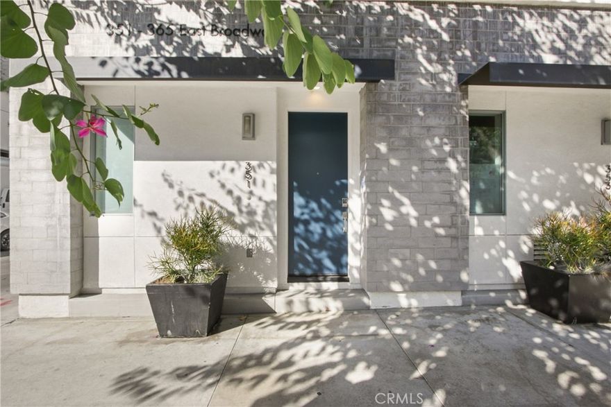 Welcome to The Huxton Community, a 40 unit townhome community built in 2019. The Huxton is centrally located between Downtown Long Beach and the creative East Village Arts District. This corner end-unit features a multi floor plan with the one car attached garage on the main entry floor with direct access. The second floor features an open concept kitchen, living room, dining area and half bath. The modern kitchen is nicely appointed with quartz countertops, stainless steel appliances, modern cabinetry, hexagons tiled flooring, recessed lighting high ceilings and an abundance of natural light.  The third floor is complete with stackable laundry closet, oversized bathroom with built in Murphy Bed, large closet, three quarter bathroom with generous step in shower wall to ceiling tile and built in seating, vanity with ample storage, modern tiled flooring, spacious bedroom with Juliet balcony. The fourth floor is devoted to the primary suite, compete with exterior balcony with city views, walk in closet, primary three quarter bath with step in shower, dual vanity, and modern tiled floor.  This energy efficient all electric build is equipped with solar power panel production,  pre-wired for an EV charger, and 1 car attached garage with storage area. The Huxton Community offers access to  the modern clubhouse and beautifully landscaped courtyard just steps from the unit. Just step out your front door and enjoy the hustle and bustle of the energetic East Village Arts District.  Walking distance community cafes, eateries and galleries. Enjoy the active nightlight that Downtown has to offer. Just a quick stroll to the coast line where you can enjoy a day at the beach or one of the many planned events that Long Beach has to offer through out the year. Convenient access to public transportation including the Metro Blue Line.