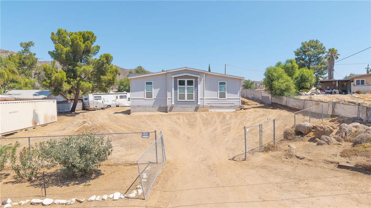Look no further! This stunning 4 bedroom, 2 bathroom, single story, triple wide, manufactured home is located on a 0.45 acre lot providing ample space with RV access and parking. With it's 2,563sqft. Inside, high ceilings, open floor plan, and a combination of plush carpet and laminate wood flooring that flows throughout. The spacious living room takes center stage, and the open kitchen design and walk in pantry is a dream come true. The location is amazing, easy access to highways and freeways for commuters, shopping near by, yet located in the foothills. Don't miss out on this unique opportunity, schedule a viewing today!