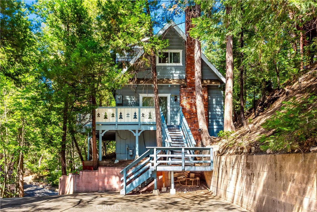 PRICE ADJUSTED to $448,900 to reflect the SELLLER'S MOTIVATION and the EXCELLENT OPPORTUNITY, this home presents WITH GREAT INCOME POTENTIAL. Welcome to your MOUNTAIN RETREAT with FULL LAKE RIGHTS, and an ACTIVE Airbnb LICENSE in the heart of beautiful Lake Arrowhead, with a UNBEATABLE LOCATION, just a SHORT Walk to Village Shops & Restaurants, Brewery & Lake Arrowhead Burnt Mill Beach Club. This charming and thoughtfully upgraded home offers 1,088 sq. ft. of cozy living space, situated on a 7,000 sq. ft. lot, surrounded by towering pines and crisp alpine air. Whether you’re looking for a Full-time Residence, Vacation Home, or INCOME-PRODUCING short-term rental, this property is OFFERED FULLY FURNISHED (with exclusions) and ready to enjoy from day one.
With THREE BEDROOMS and TWO FULL BATHROOMS, this home offers both comfort and flexibility.
The light-filled interior features NEWLY INSTALLED CARPET upstairs, FRESH INTERIOR PAINT, and NEW DUAL-PANE WINDOWS throughout, bringing in natural light while enhancing energy efficiency and comfort year-round.
The spacious living area is anchored by a WOOD-BURNING FIREPLACE, perfect for those cozy winter evenings in the mountains.
The recently UPDATED KITCHEN is both functional and stylish, with NEW STAINLESS STEEL APPLIANCES (stove and refrigerator), FRESHLY PAINTED CABINETRY, and NEW STONE TILE FLOORING, making it the ideal space for mountain meals and morning coffee.
Both BATHROOMS have been TASTEFULLY REMODELED approximately two years ago, offering a clean and refreshed feel.
Additional features include a TANKLESS WATER HEATER, CEILING FANS in the upstairs bedrooms (installed just two years ago), and a TREX-STYLE COMPOSITE DECK installed approximately 2.5 years ago, perfect for entertaining or relaxing with tree-top views.
Best of all, with FULL LAKE RIGHTS! ENJOY EXCLUSIVE ACCESS to Lake Arrowhead for SWIMMING, KAYAKING, PADDLEBOARDING and BOATING, access to PRIVATE BEACH CLUBS, trails, and all ALA-MAINTAINED AMENITIES a major lifestyle advantage and a HUGE SELLING POINT for VACATIONERS and full-time residents alike.
Located on one of Lake Arrowhead’s most picturesque streets, and close to everything this beloved alpine community offers, this is your opportunity to own a piece of the mountain lifestyle. Whether you’re looking for adventure, tranquility, or a smart investment opportunity, this home is ready to deliver it all. Don’t miss your chance to make it yours—schedule your private showing today!